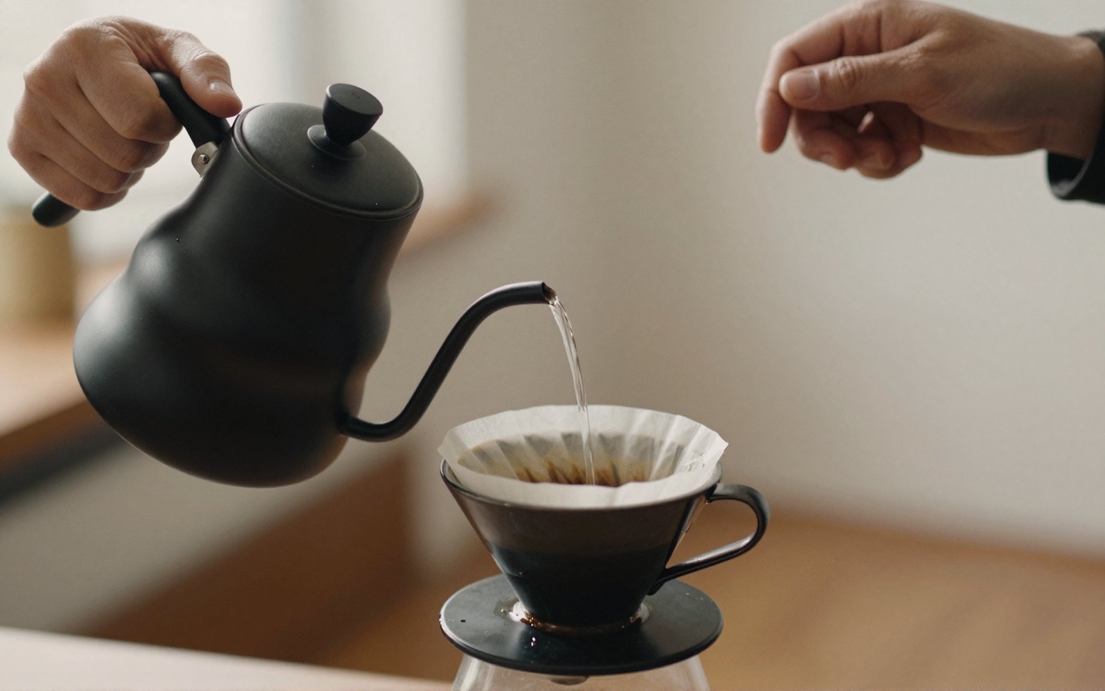 The pour is the whole technique: slow, central, and never rushing the bloom.